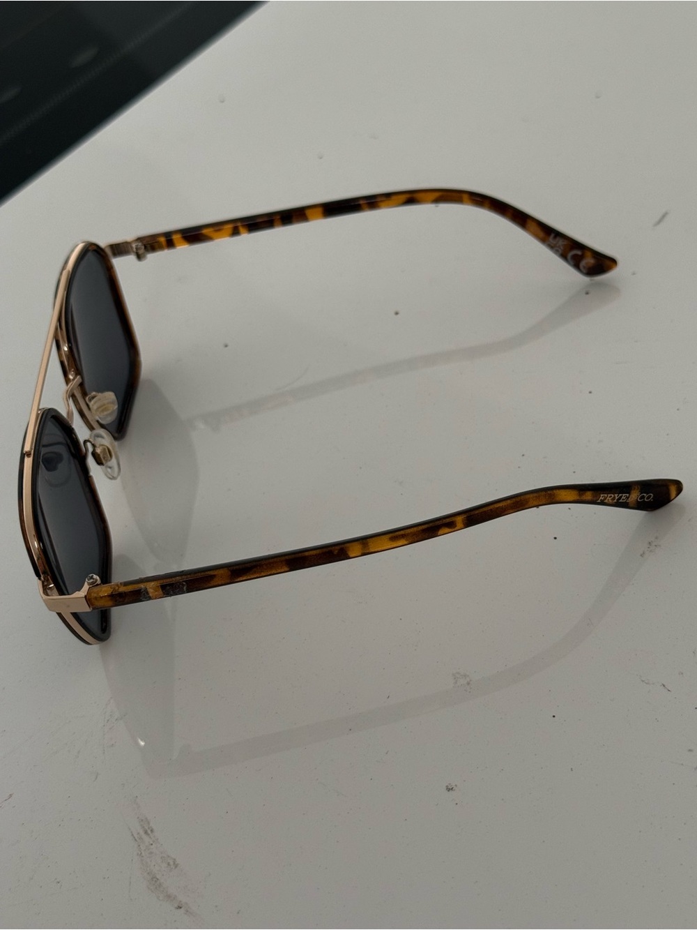FRYE AND CO. Tortoiseshell Frame with Gold Accents and Black Lenses